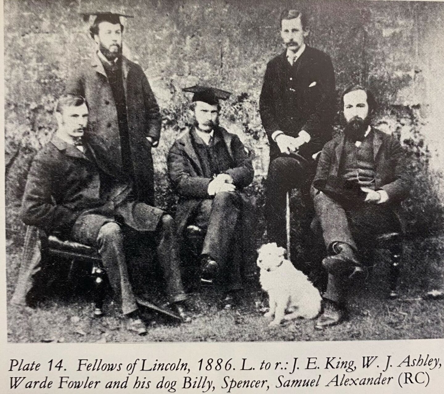 Old photograph of five Lincoln Fellows and a dog