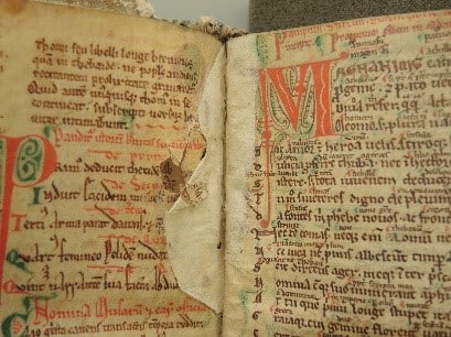 Beautiful open 12th century manuscript owned by Robert Fleming, with colourful text