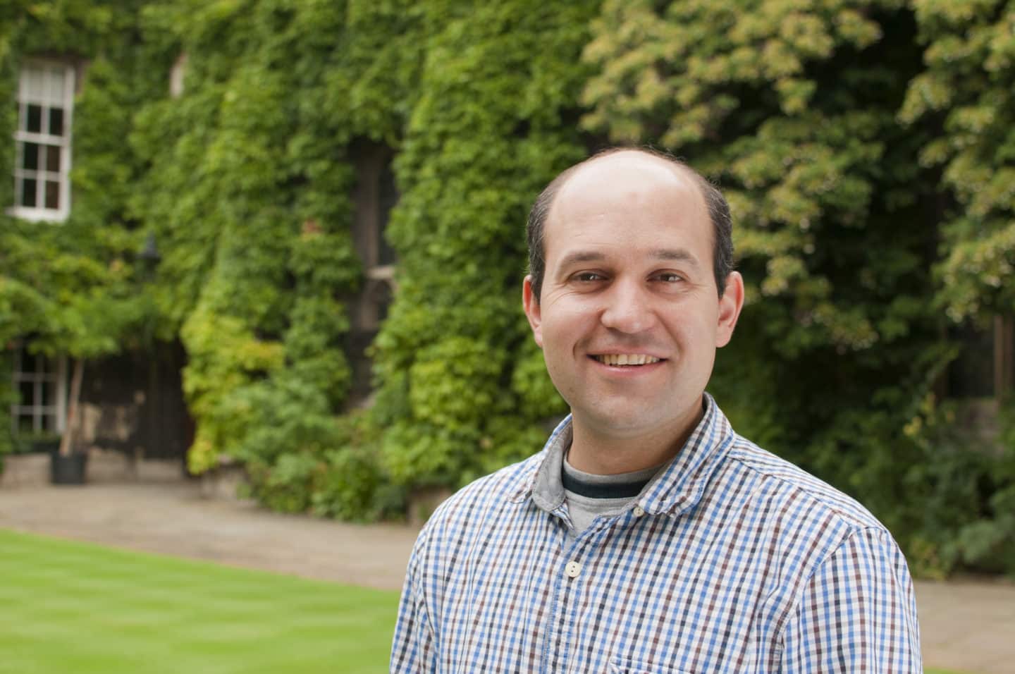 Headshot of Professor Radu Coldea, a man in a checked shirt