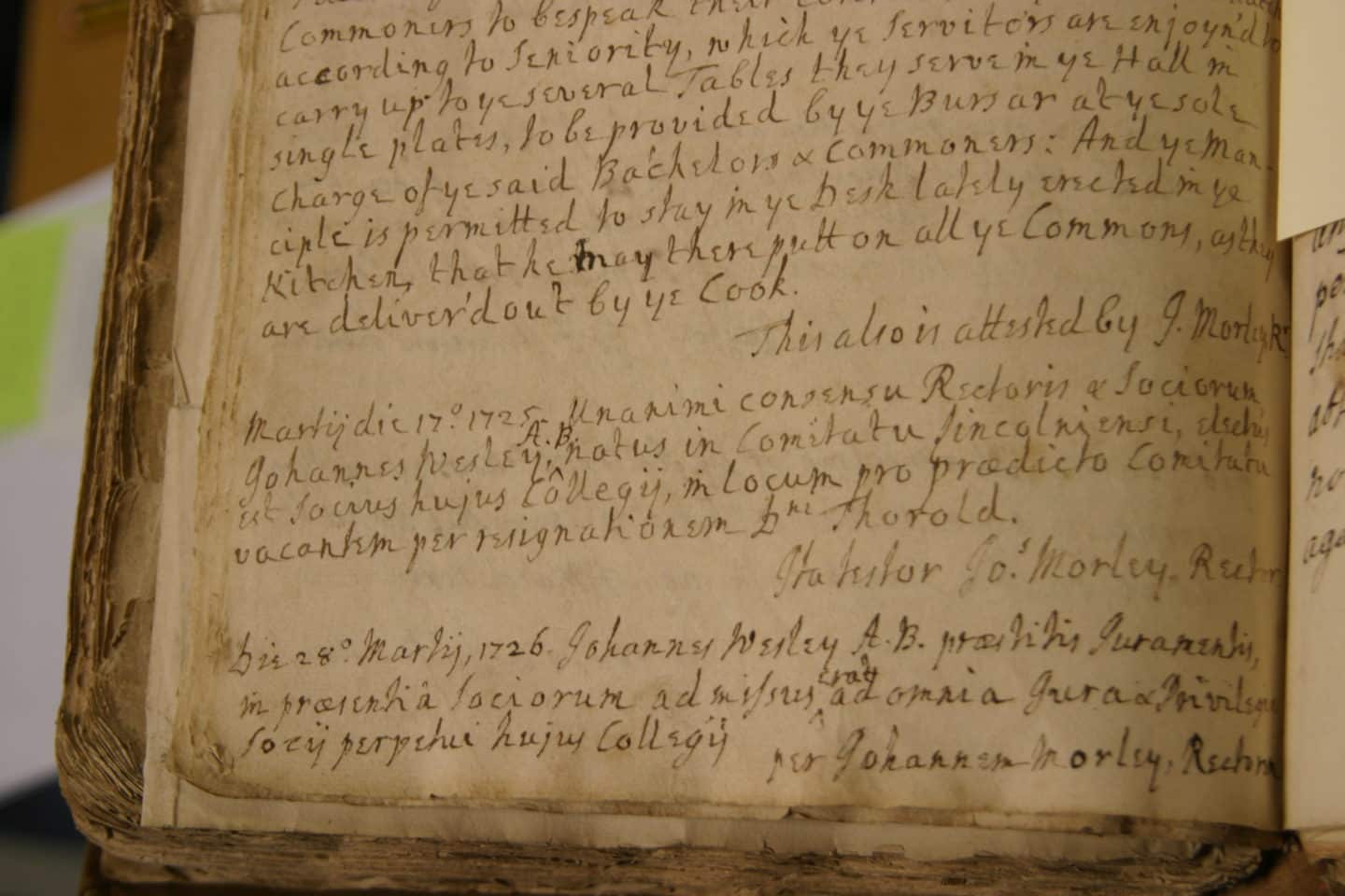 Old page with handwritten text featuring Wesley's election in the College Register