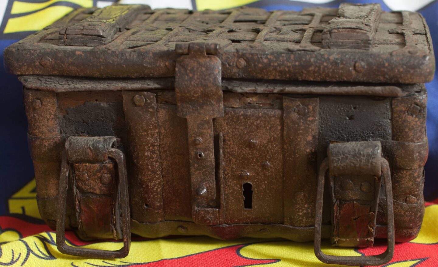 Old and rusted wooden box with iron fixings and straps