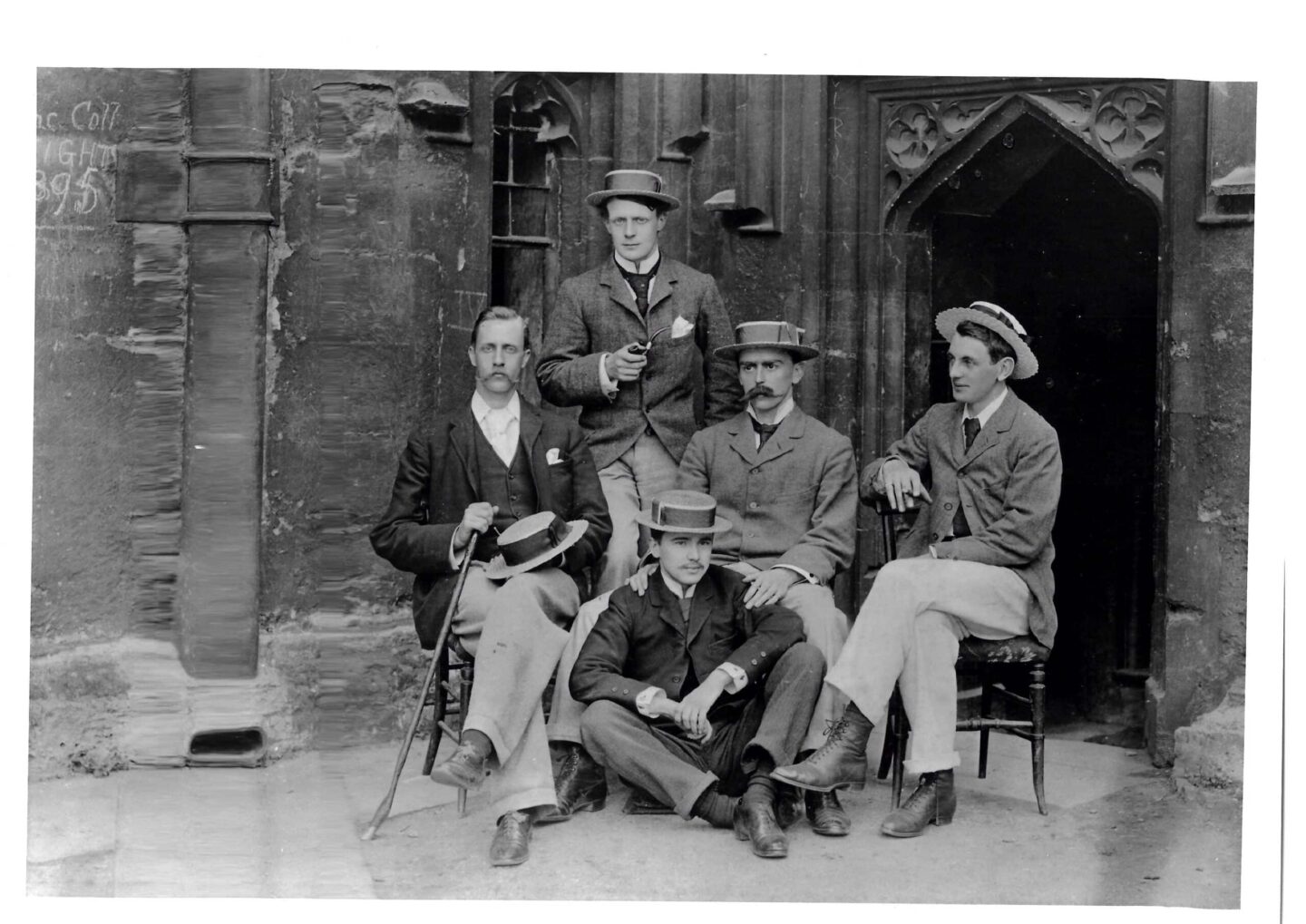 Old greyscale photograph of five men